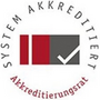 Systemakkreditierungssiegel mit einem Häkchen und den Worten "System Akkreditiert" und "Akkreditierungsrat".